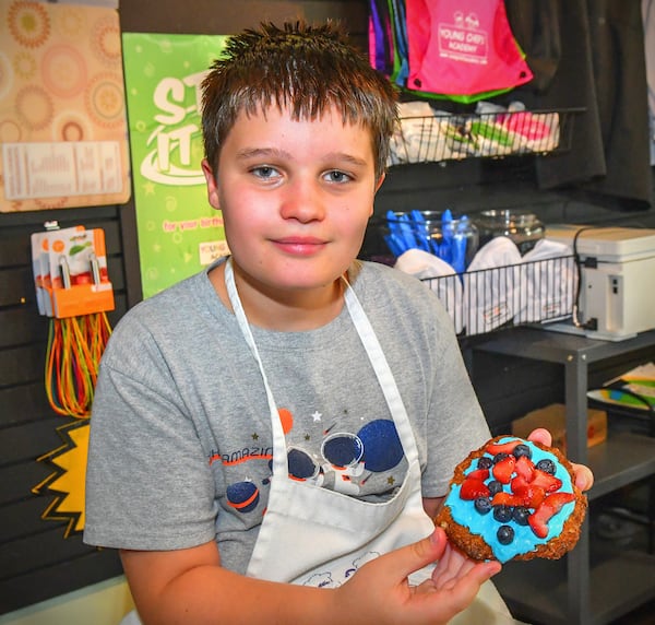 Connor Kolwaite, 10, of Auburn, Ala., shows the fruits of his labor in the form of an Oatmeal Cookie Crust that he created during a recent class at Young Chefs Academy. CONTRIBUTED BY CHRIS HUNT PHOTOGRAPHY