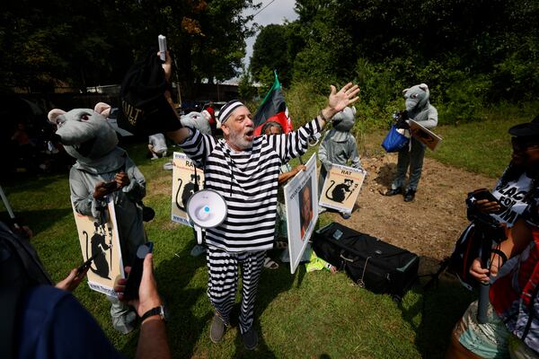 Domenic Santana yells as he protests with the group called (RAT) Republicans Against Trump outside of the Fulton County Jail on Thursday, August 24

Miguel Martinez /miguel.martinezjimenez@ajc.com