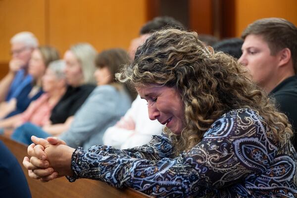 Roya Jahangard, whose brother Hamid Jahangard was hit and killed in 2019, cries during a bond hearing in Fulton Superior Court where Bryan Keith Schmitt was granted bond Thursday, July 25, 2024, after his conviction in the death was overturned  (Ben Gray / Ben@BenGray.com)