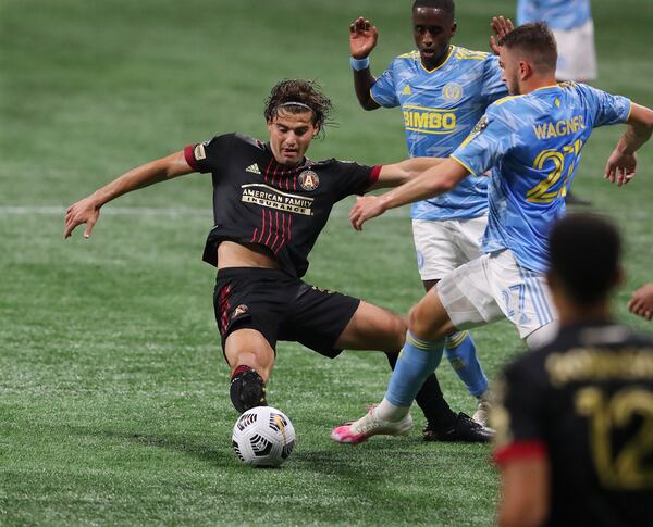 Atlanta United midfielder Santiago Sosa (left) fights for control of the ball against the Philadelphia Union during the first leg of the CONCACAF Champions League quarterfinals Tuesday, April 27, 2021, at Mercedes-Benz Stadium in Atlanta. Philadelphia won 3-0. (Curtis Compton / Curtis.Compton@ajc.com)