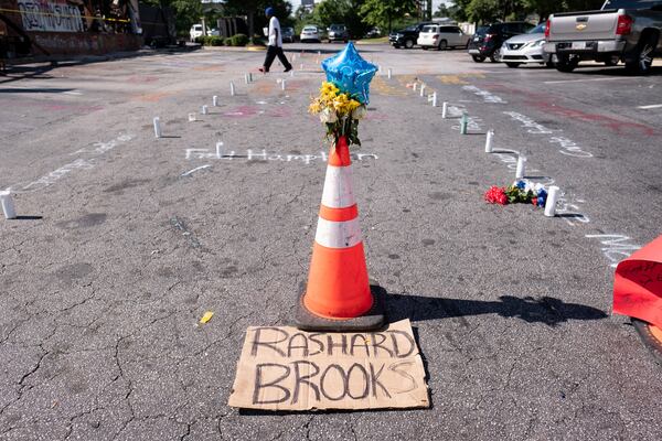 People left items and tokens of affection for the memory of Rayshard Brooks outside of the Wendy's where he was shot and killed Friday night.