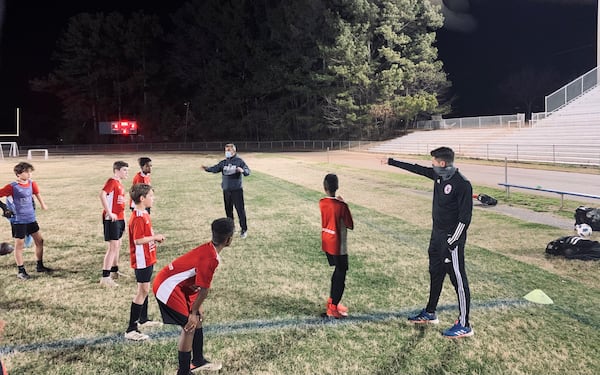 Former Atlanta United player Mark Bloom works with players from Georgia Alliance FC during a recent training session.