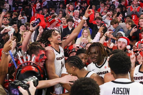 Georgia's Asa Newell celebrates with fans after the Bulldogs' win over No. 6 Kentucky.
