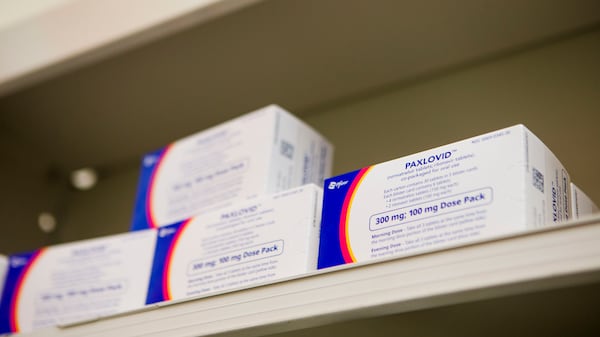 Paxlovid, a Covid-19 treatment medication, sits on the shelf of Little Five Points Pharmacy on Friday, December 23, 2022, in Atlanta. Pharmacist Ira Katz distributes Paxlovid to those with a prescription. CHRISTINA MATACOTTA FOR THE ATLANTA JOURNAL-CONSTITUTION.