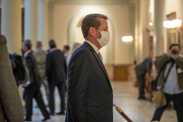 Gov. Brian Kemp returns to his office following a press conference about COVID-19 at the Georgia State Capitol on Tuesday. (Alyssa Pointer / Alyssa.Pointer@ajc.com)