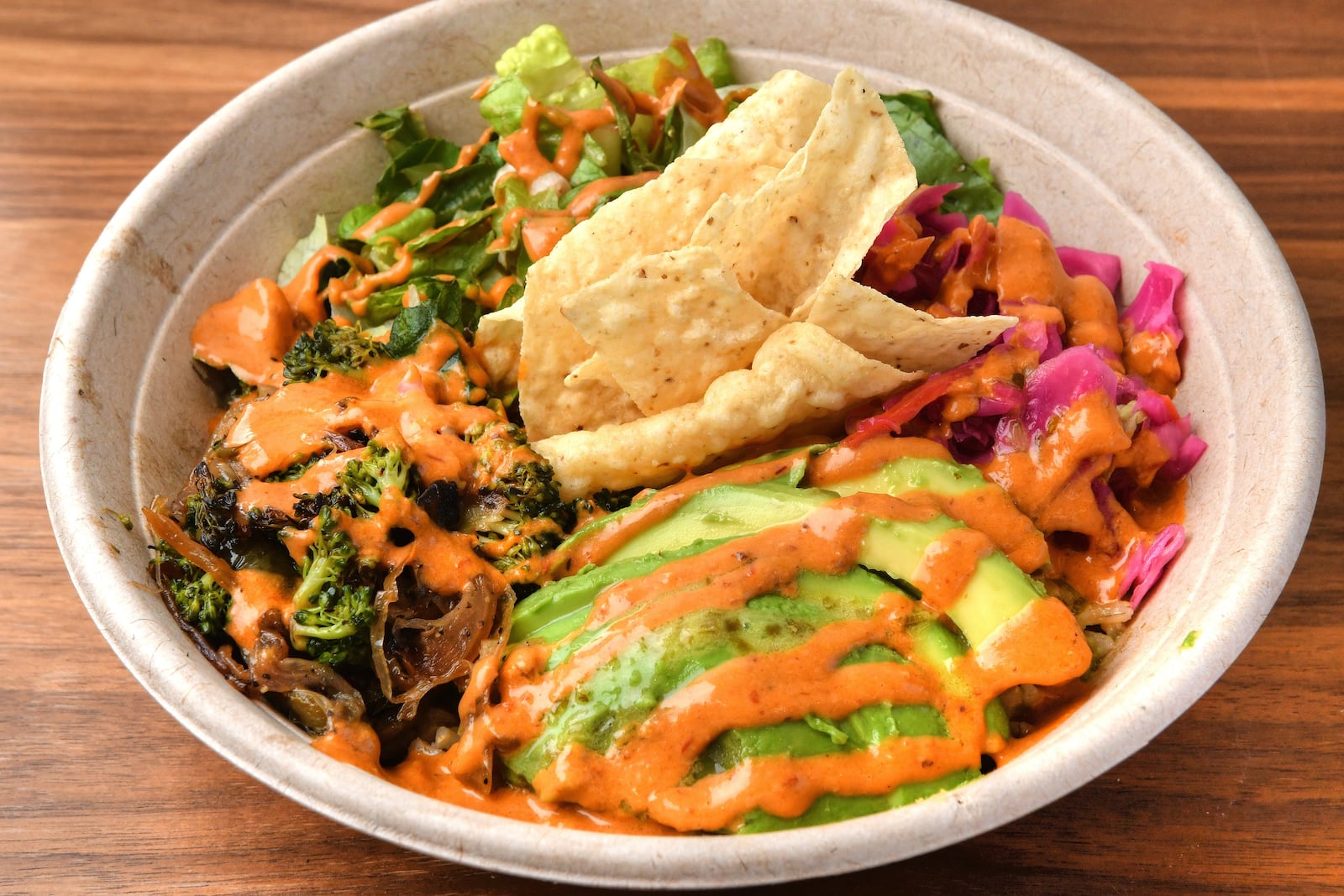 Lime to Me bowl at Papi Ali's (cilantro lime rice, lettuce, black beans, avocado, roasted veggies, slaw and chipotle crema). (Chris Hunt for The Atlanta Journal-Constitution)