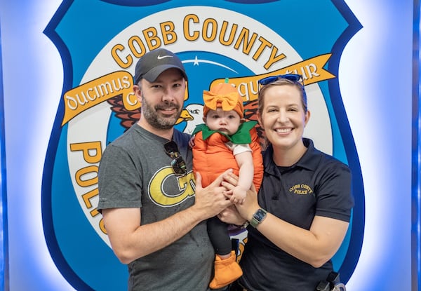 Cobb County Lt. Jackie Piper, with her husband Jacob and 7-month-old daughter Leah.