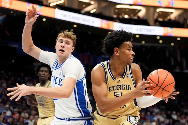 In this oddly satisfying photo, Georgia Tech guard Jaeden Mustaf (right) drives past Duke star Cooper Flagg.