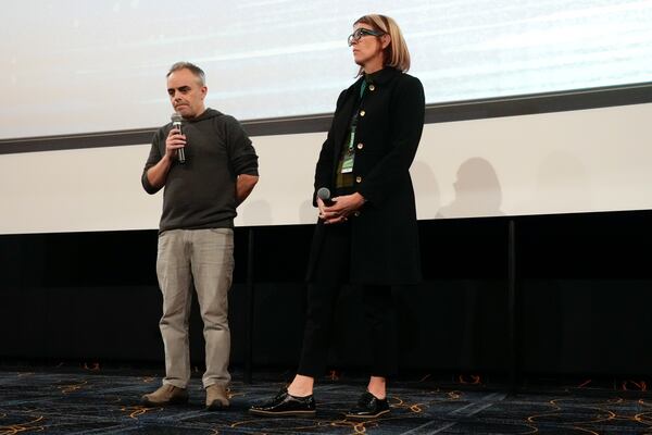 Director Joel Souza, left, and cinematographer Bianca Cline, right, attend the premiere of the film 'Rust' during the 32nd Camerimage International Film Festival in Torun, Poland, Wednesday, Nov. 20, 2024. (AP Photo/Czarek Sokolowski)