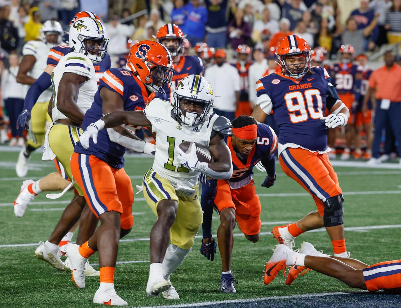 Georgia Tech Yellow Jackets running back Jamal Haynes (11) scores Tech's first touchdown during the first half of an NCAA college football game between Georgia Tech and Syracuse in Atlanta on Saturday, Nov. 18, 2023.   (Bob Andres for the Atlanta Journal Constitution)