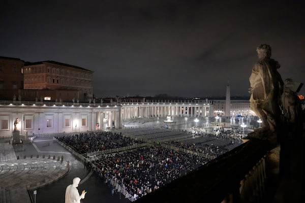 People attend a rosary prayer service held for the health of Pope Francis in St Peter's Square at The Vatican, Monday, Feb. 24, 2025. (AP Photo/Kirsty Wigglesworth)