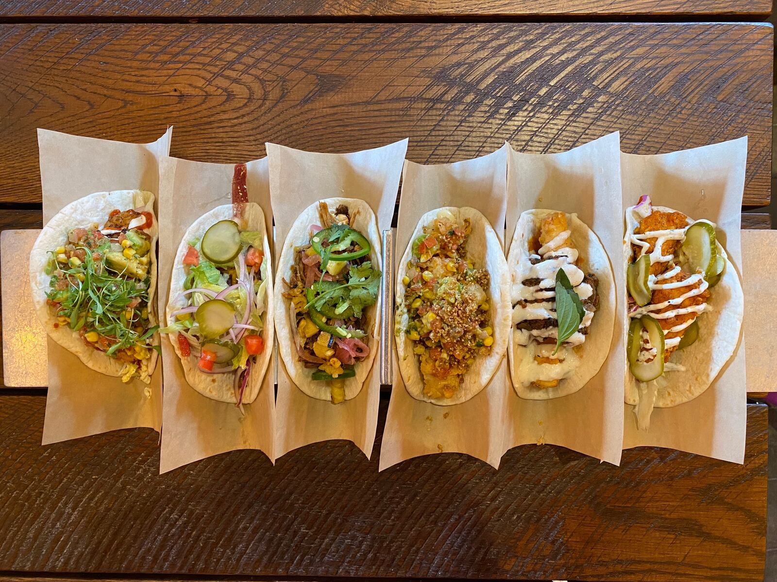 Velvet Taco offers more than 20 tacos that feature flavor combinations inspired by international cuisines. (Ligaya Figueras / ligaya.figueras@ajc.com)