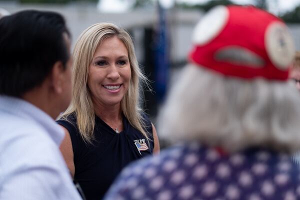 200829-Rome-Marjorie Taylor Greene, a Republican running to represent Georgia’s 14th congressional district, talks with supporters Saturday morning August 29, 2020 at a political rally at the Rome fairgrounds. Ben Gray for the Atlanta Journal-Constitution