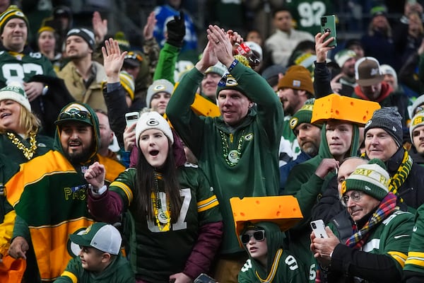 Green Bay Packers fans cheer during the second half of an NFL football game against the Seattle Seahawks Sunday, Dec. 15, 2024, in Seattle. (AP Photo/Lindsey Wasson)