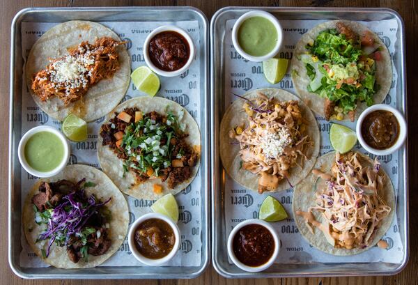 Tacos at Taco Cantina in Old Fourth Ward: (left tray, from top) la tinga pollo, chorizo cantina and la carne asada; (right tray, from top) pescado frito, camaron frito and fried chicken. CONTRIBUTED BY HENRI HOLLIS