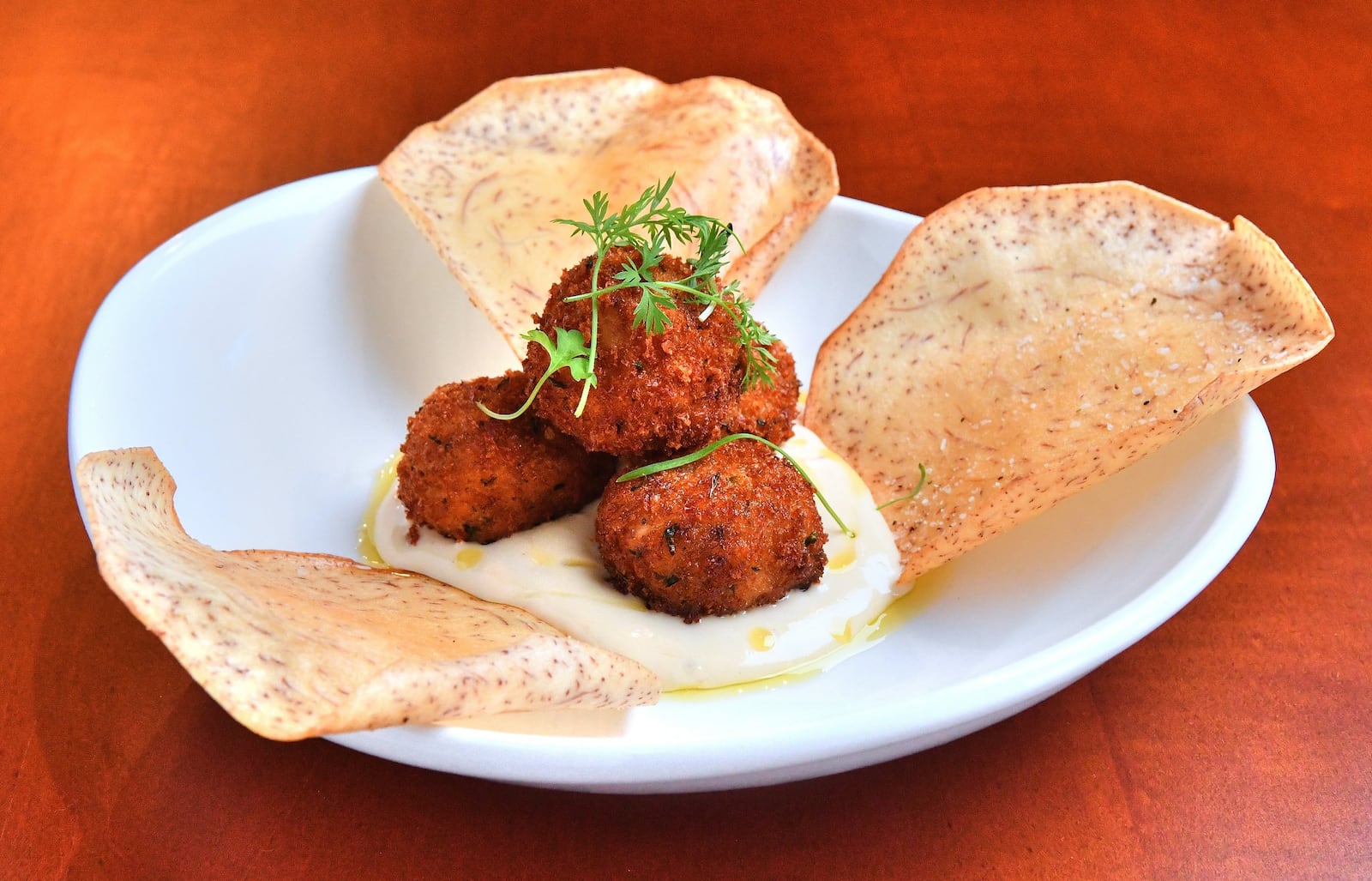 Crab Beignets  with lemon aioli. (Contributed by Chris Hunt Photography)