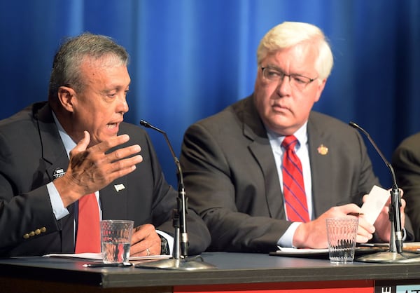 Cobb County Commission chair candidates Mike Boyce (left) and incumbent Tim Lee are shown during an Atlanta Press Club debate. (KENT D. JOHNSON/kdjohnson@ajc.com)