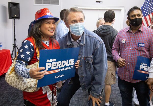 
Sen. David Perdue poses for photographs at an event at the Republican Party Headquarters in Marietta on Oct.10, 2020. (STEVE SCHAEFER / SPECIAL TO THE AJC )