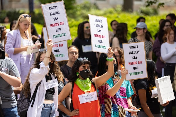 Faculty and staff demonstrate at Emory University in Atlanta on Monday.