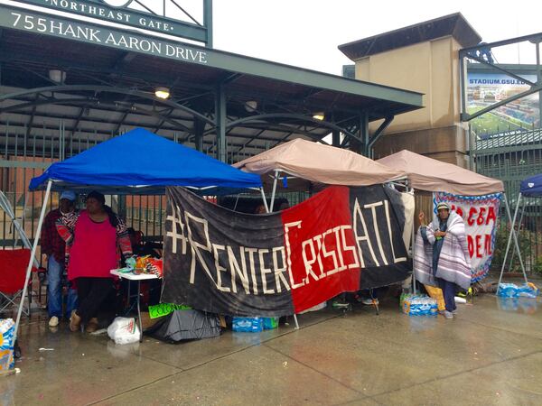 A group of residents in the neighborhoods opposed to the sale of Turner Field have erected tents outside the ballpark. J. Scott Trubey/strubey@ajc.com