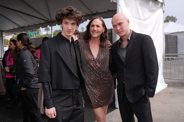 Mark Eydelshteyn, from left, Molly Shannon and Yuriy Borisov arrive at the Film Independent Spirit Awards on Saturday, Feb. 22, 2025, in Santa Monica, Calif. (AP Photo/Chris Pizzello)