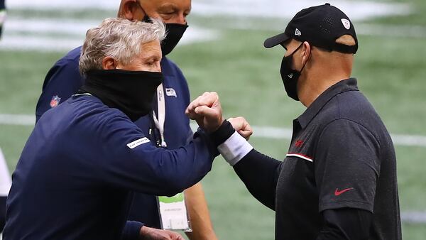 Falcons head coach Dan Quinn greets Seahawks head coach Pete Carroll after Seattle's 38-25 win in the season opener Sunday, Sept. 13, 2020, at Mercedes-Benz Stadium in Atlanta.  (Curtis Compton / Curtis.Compton@ajc.com)