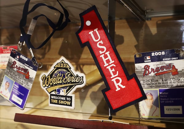 Just a few of Walter Banks' Braves trinkets on display now at the onUp Experience in The Battery. (Curtis Compton/ccompton@ajc.com)