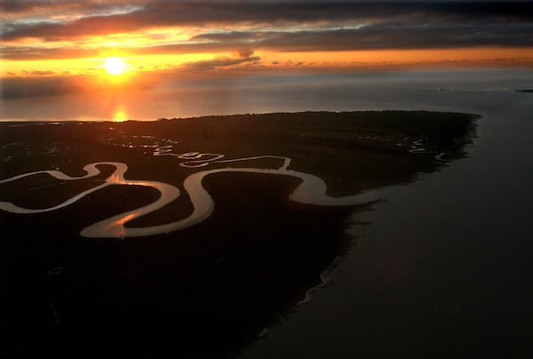 The early morning sun breaks through the clouds over Ossabaw Island, Ga., on Friday, Nov. 17, 2006. CURTIS COMPTON / THE ATLANTA JOURNAL-CONSTITUTION