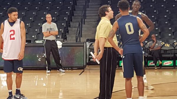 Ron Bell, second from left, observes Georgia Tech men’s basketball coach Josh Pastner conduct a practice session. File photo