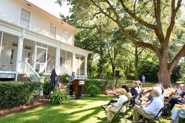 Visitors gather on the front lawn of Andalusia, the home in Milledgeville where Flannery O'Connor wrote many of her short stories and novels.