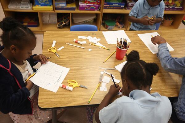 Kindergarten student Hailey Hubbard cuts out shapes during class. 