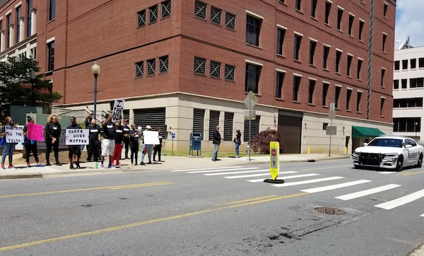 Activists protest the treatment of Renardo Lewis by Marietta police Friday outside the Cobb County courthouse.