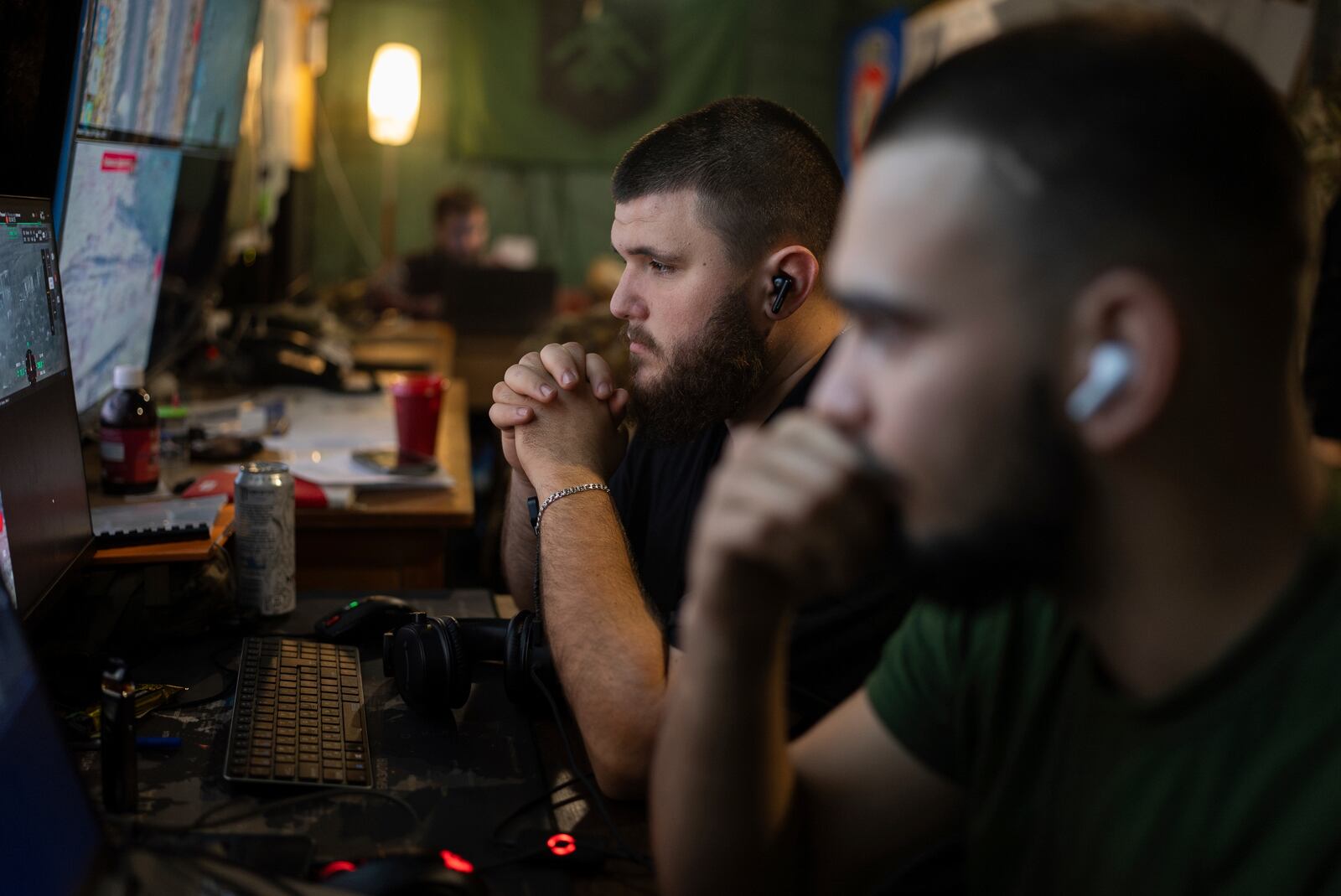 Ukrainian servicemen of Khartia brigade control the drone aerial view in the command centre in Kharkiv region, Ukraine, Wednesday, Oct. 16, 2024. (AP Photo/Alex Babenko)