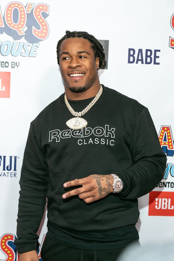 Devonta Freeman poses on the red carpet ahead of his "Shaq's Fun House" event at The Battery Atlanta on Friday, Feb. 1, 2019. (Ryan Fleisher/Special to The AJC)