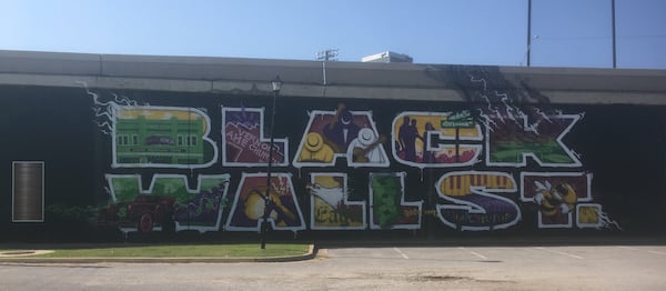 Images from Tulsa's Black Wall Street include a mural, street sign, historic sign and a photo of Vernon AME Church.