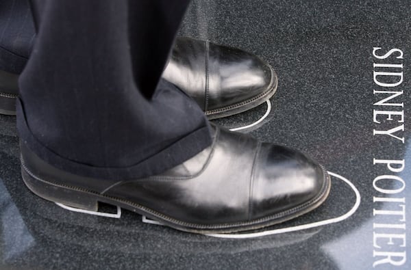 Actor and director Sidney Poitier became emotional as he stepped into his footprints as part of the International Civil Rights Walk of Fame. AJC file