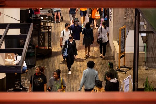 People walk through Ponce City Market both masked and unmasked on Tuesday, July 19, 2022, in Atlanta. (Chris Day/Christopher.Day@ajc.com)