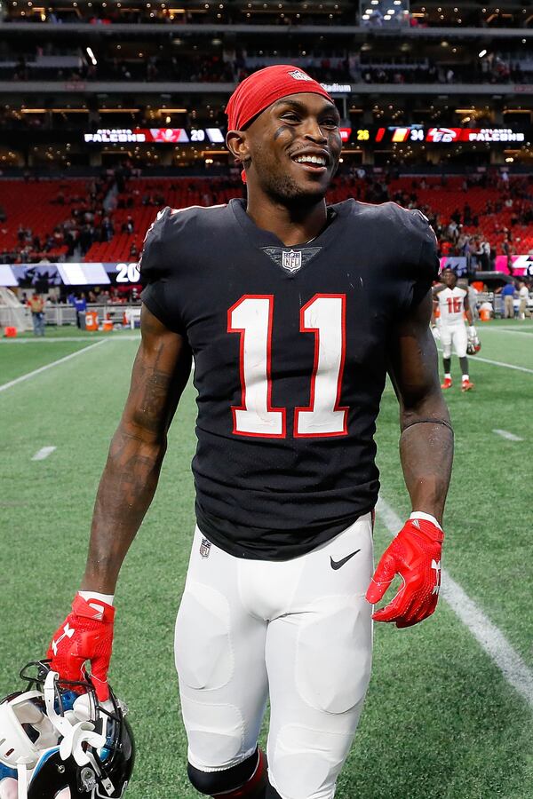 Julio Jones of the Falcons celebrates Sunday’s 34-20 win over the Tampa Bay Buccaneers at Mercedes-Benz Stadium. Jones has 12 catches for 253 yards, including two touchdowns.