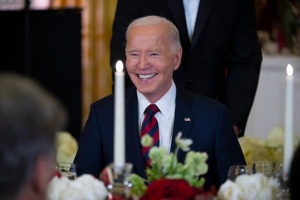 President Joe Biden smiles as he attends a dinner to celebrate the Special Olympics at the White House on Tuesday.