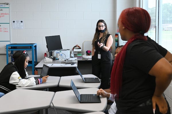 Scarlett Jarquin (background) gets to know her new students during Spanish I class on the first day of school at Seckinger High School in Buford on Wednesday, Aug. 3, 2022. (Hyosub Shin / Hyosub.Shin@ajc.com)