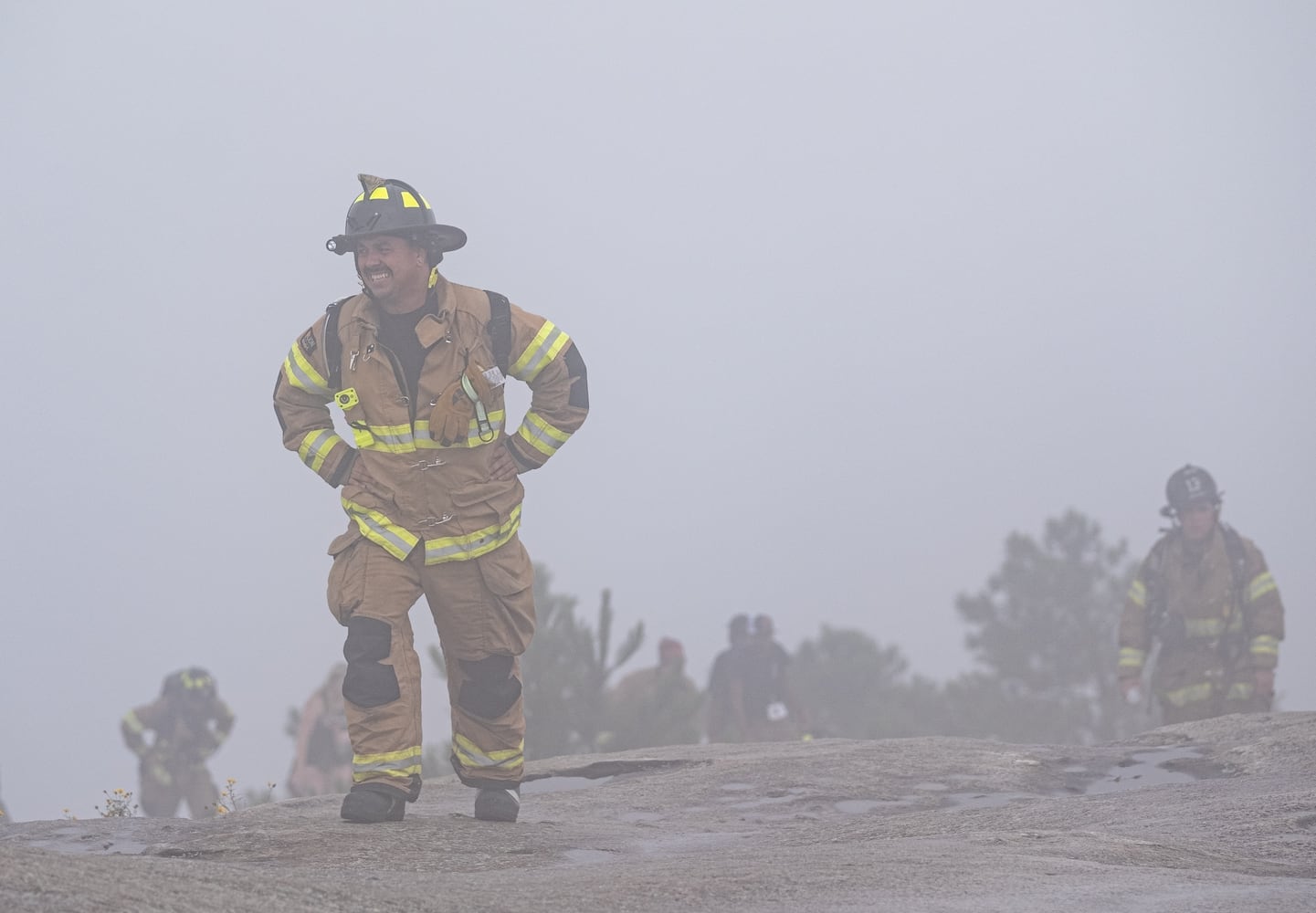 Firefighters climb Stone Mountain on Sunday morning, Sept. 11, 2022, during the annual remembrance of the 9/11 terrorist attacks. (Photo: Ben Gray for The Atlanta Journal-Constitution)