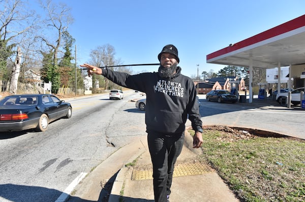 February 24, 2021 Atlanta - Brian Page waves as he is recognized by a neighbor outside the Exxon gas station in his southwest DeKalb neighborhood on Wednesday, February 24, 2021. Page launched a protest and boycott of the Exxon gas station in his Southwest DeKalb neighborhood, after a clerk told one customer he didn't "give a f--- about the black community" and the owner called him a "food stamp cockroach." They protested outside the store for 66 days -- and it worked. The owner agreed to sell. (Hyosub Shin / Hyosub.Shin@ajc.com)