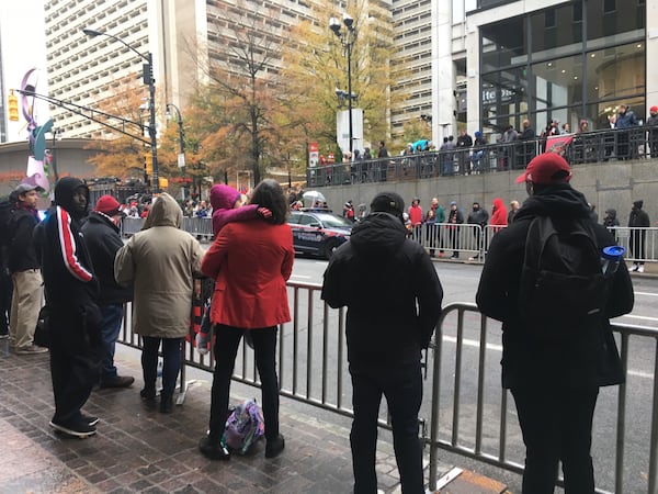 Jonathan Jones, 21, at far right in the red hat, stood by at a barricade looking at a closed and empty street, waiting for the parade to start. “This is the first championship in my lifetime, and I actually like the team,” he said.