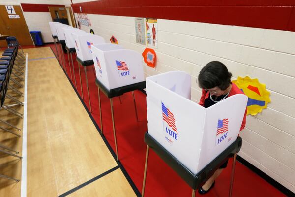 A  voter makes her choice during the Democratic Presidential primary voting Tuesday, March 3, 2020, in Richmond, Va. (AP Photo/Steve Helber)