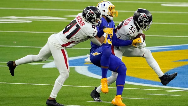 Atlanta Falcons cornerback Blidi Wreh-Wilson (33) intercepts a pass intended for Los Angeles Chargers wide receiver Keenan Allen (center) late in the fourth quarter Sunday, Dec. 13, 2020, in Inglewood, Calif. (Ashley Landis/AP)