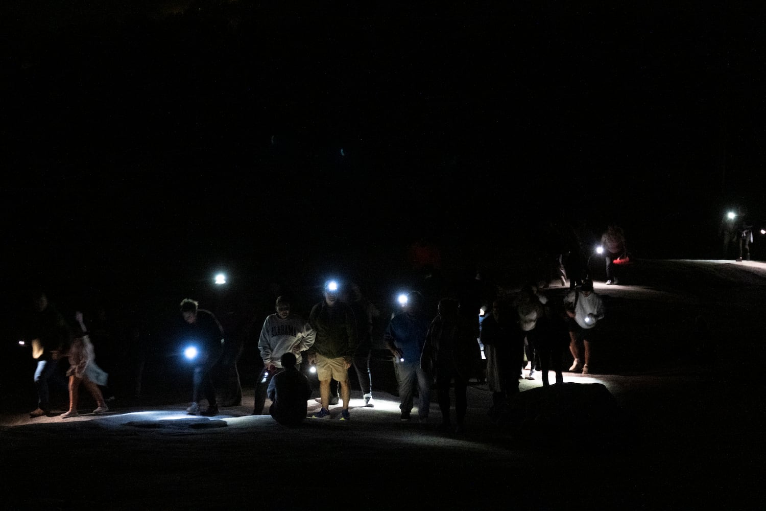 People climb Stone Mountain to attend Easter sunrise service at the top on Sunday, March 31, 2024.   (Ben Gray / Ben@BenGray.com)