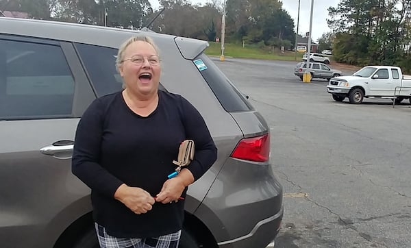 Christina Emerson, standing in an Ingles parking lot in Monticello on Nov. 9, voted for Donald Trump because she believes Kamala Harris is a Muslim, which goes against her Christian values. (Andy Peters / andy.peters@ajc.com)