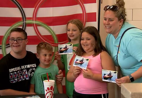 Fans get autographs and their picture taken Tuesday, June 6, 2023, at the Canton Marketplace Chick-fil-A with Georgia kayaker Caleb Guy, who will be competing in the Special Olympics World Games. (Photo: Channel 2 Action News)