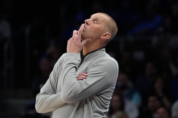 Kentucky head coach Mark Pope looks up at the score board during the first half of an NCAA college basketball game against Duke. , Tuesday, Nov. 12, 2024, in Atlanta. (AP Photo/John Bazemore )