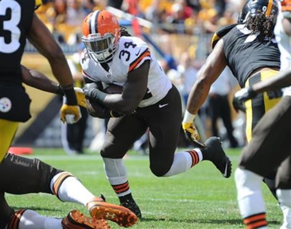 Cleveland Browns running back Isaiah Crowell (34) carrying the ball against the Pittsburgh Steelers during the third quarter of an NFL football game in Pittsburgh on Sept. 7, 2014. (AP Photo/Don Wright, File)